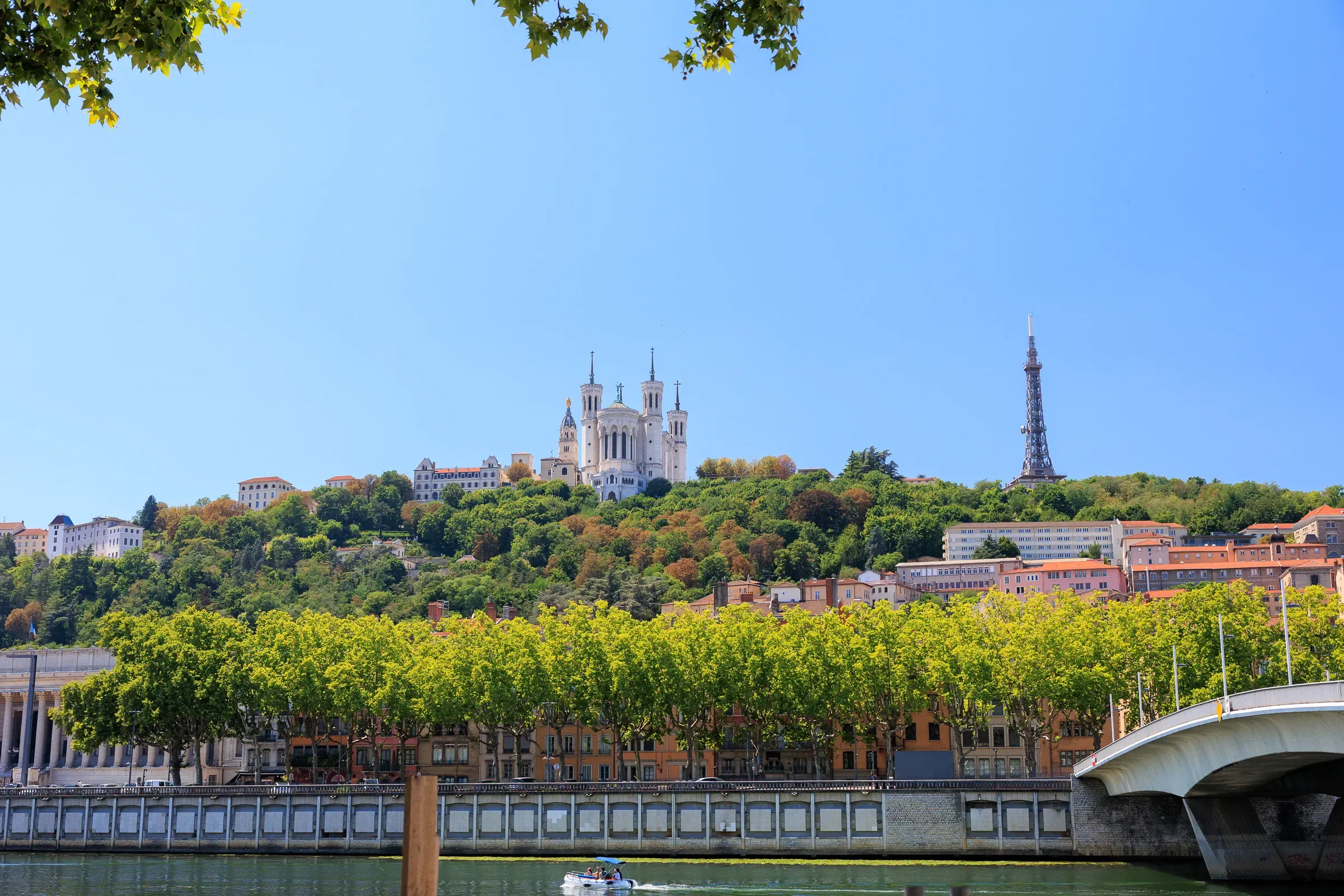 Fourvière basilica and Eiffel tower replica seen from across the Saône river, Lyon