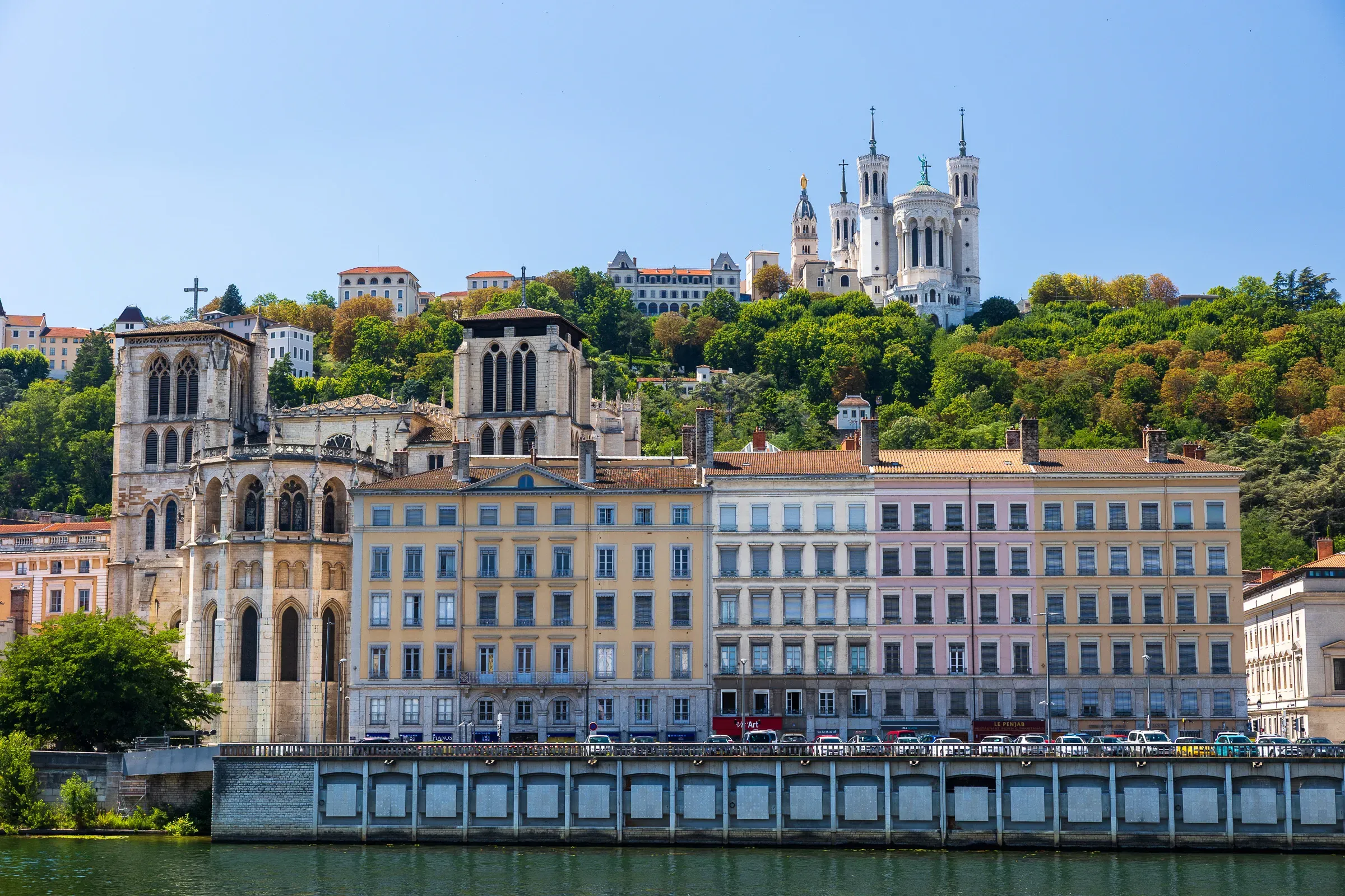 Saint-Jean cathedral and Fourvière basilica rising above riverside buildings, Lyon